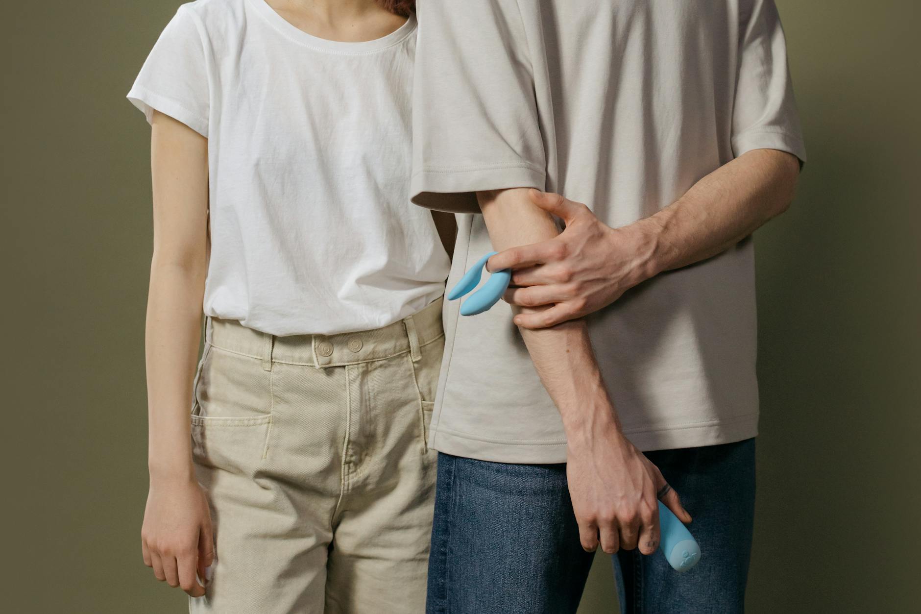 A couple exploring intimacy together with modern clitoral toy