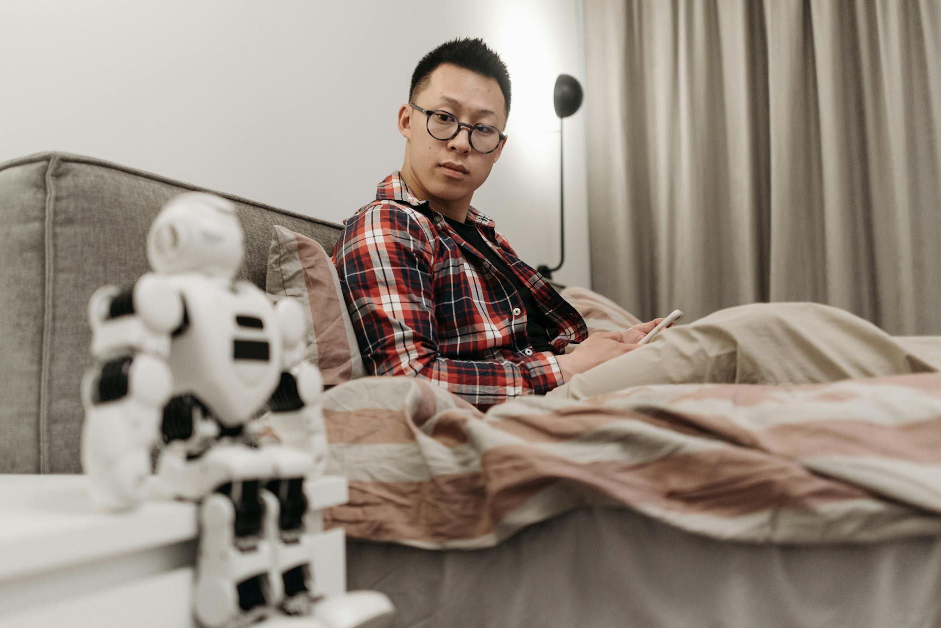 A human hand and robotic hand reaching towards each other, symbolizing human-AI connection and the intersection of technology with relationships.